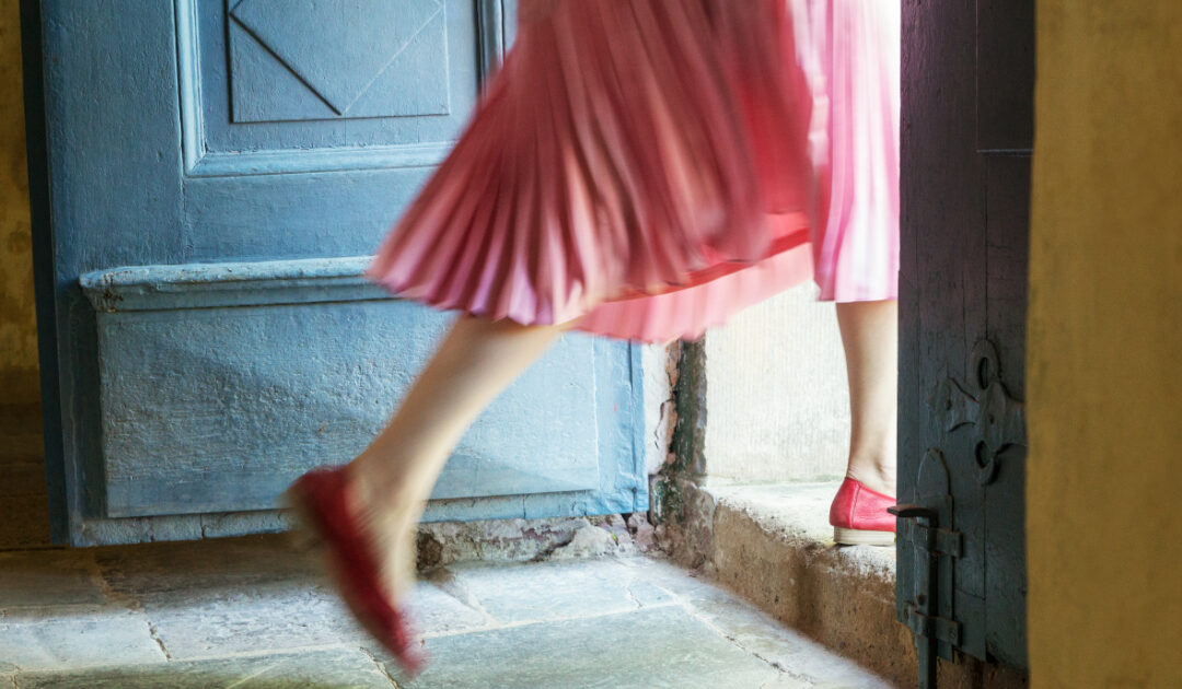 pink dress walking out of the door